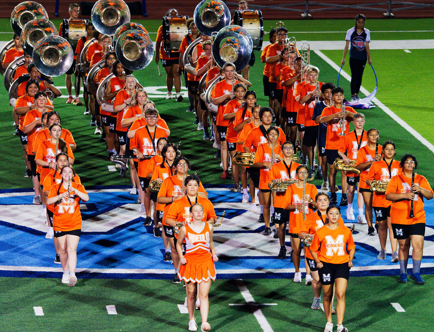 Mineola's Sound of the Swarm marching band performed its developing contest show for the Wesk Rusk crowd at half time. [catch all the action]